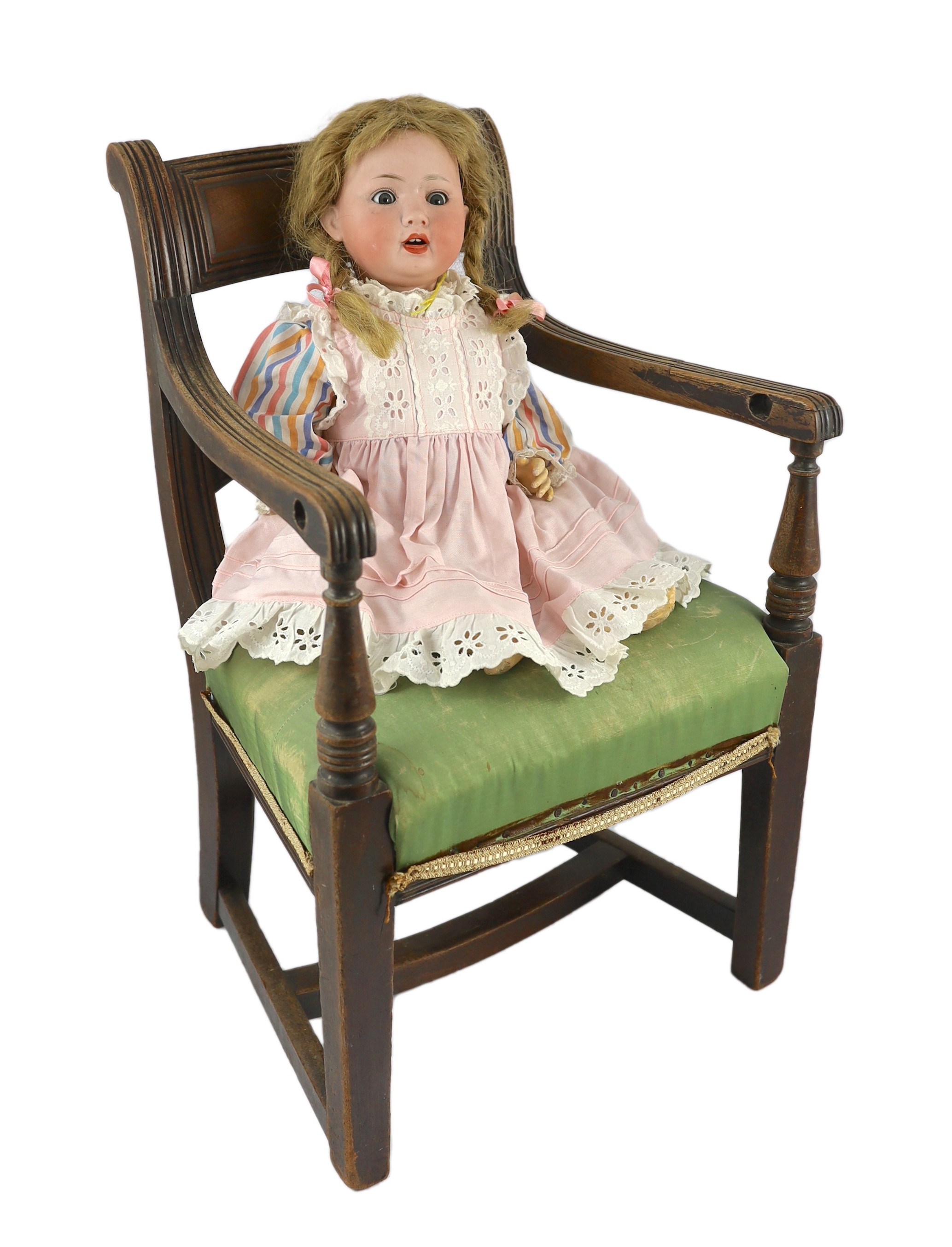 A Porzellanfabrik Mengersgereuth bisque doll, German, circa 1920, 17in. Please note the chair is for display purposes only.